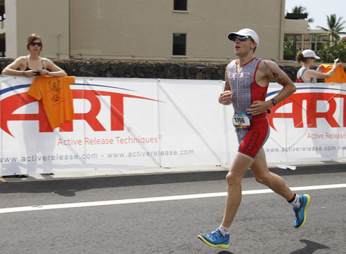 A man competing in a triathlon race