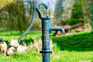 Old blue water pump made from metal