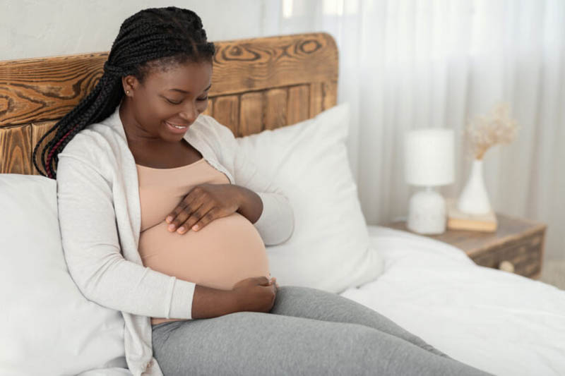 Happy Expectation. Portrait Of Young Pregnant African American Lady Relaxing At Home