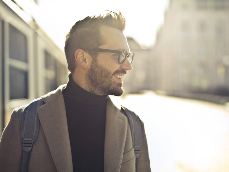 A man looking at right and smiling